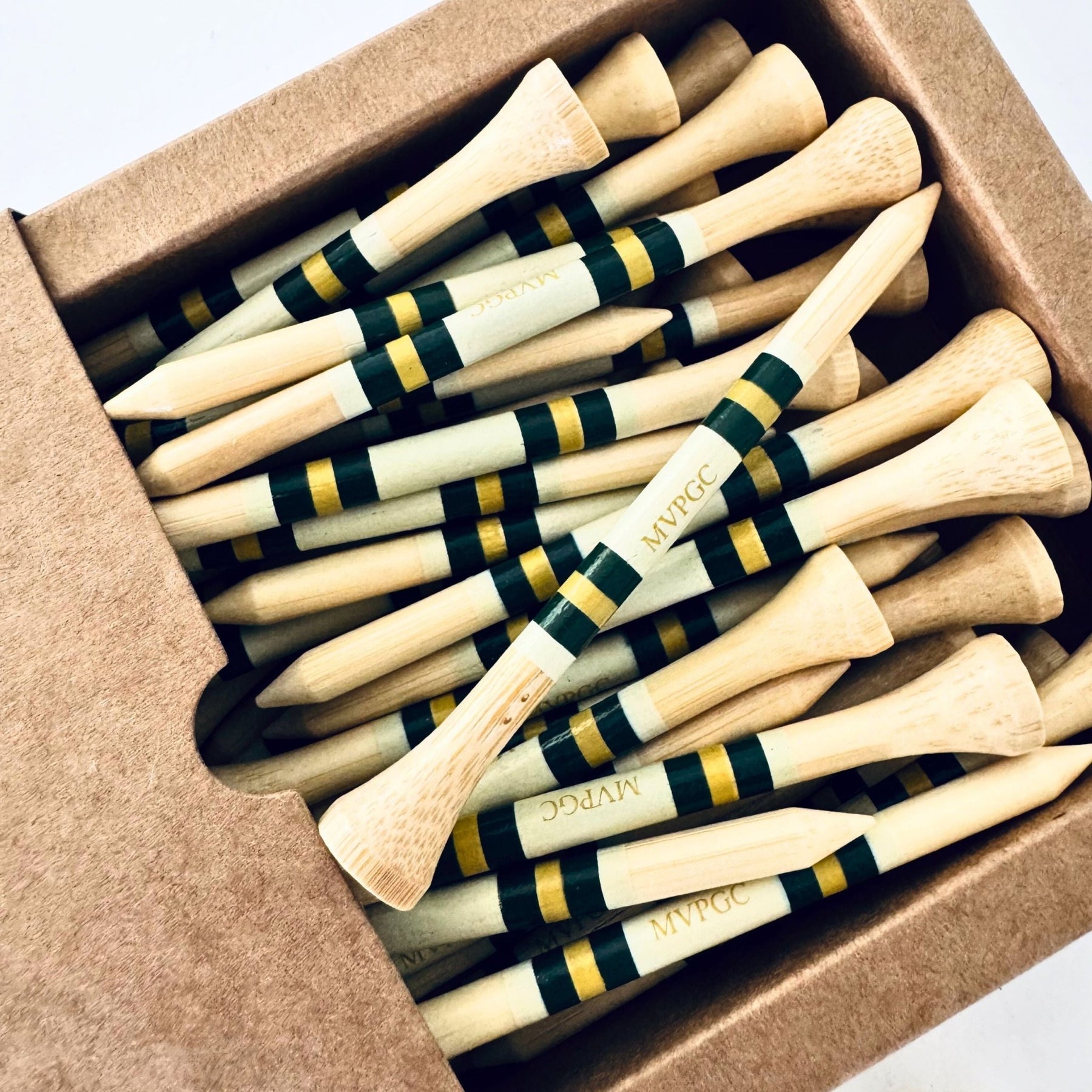 Fifty bamboo golf tees in open retail box